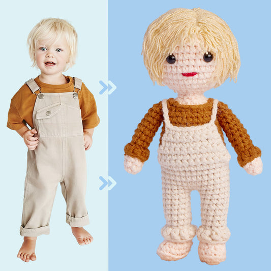 A toddler on the left compared side-by-side with a crochet doll replica on the right, both dressed in matching beige overalls and orange shirts.