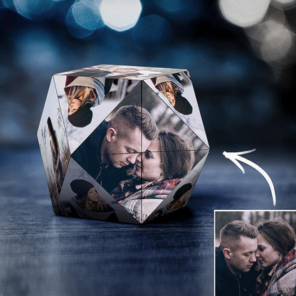 A 3D hexagonal photo cube displaying various images of a couple, with an artistic blue bokeh background. An arrow indicates the cube's rotation.