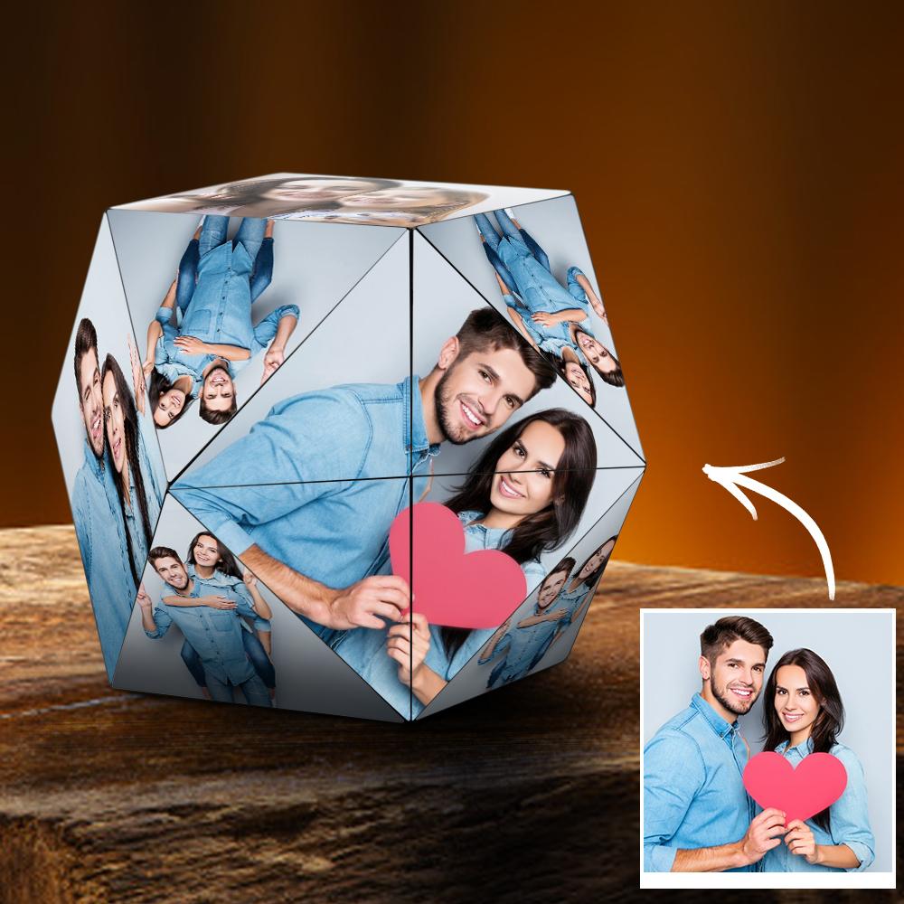 A dodecahedron photomontage with multiple smiling faces of a couple holding a red heart, placed against an orange backdrop.