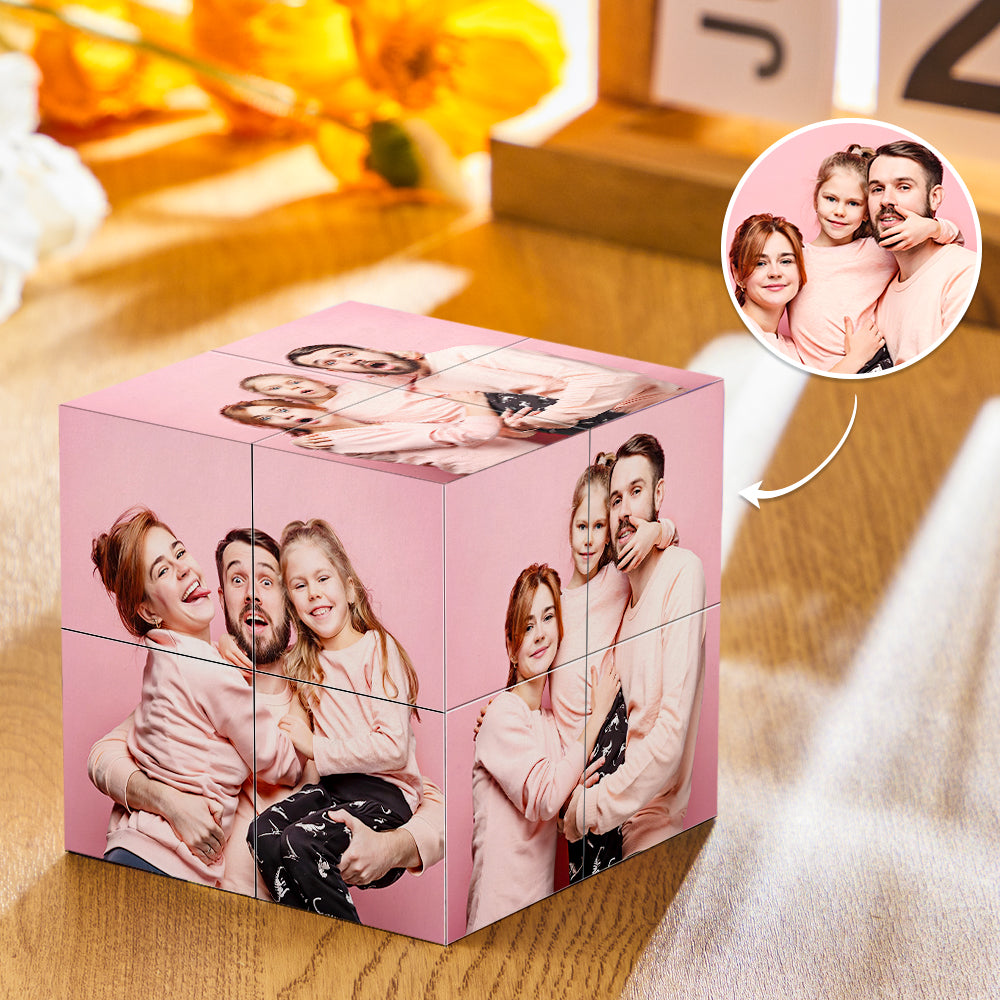 A Rubik's Cube puzzle personalized with various images of a family of four posing cheerfully, placed on a wooden surface with a blurred flower in the background.