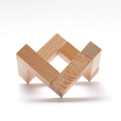 An impossible wooden structure resembling two interlocked squares creating an optical illusion, against a white background.