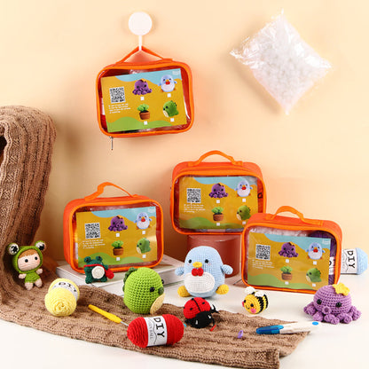 Alt text: Craft scene with colorful crocheted animals, yarn, and instruction kits in transparent orange cases, set against a warm beige backdrop.